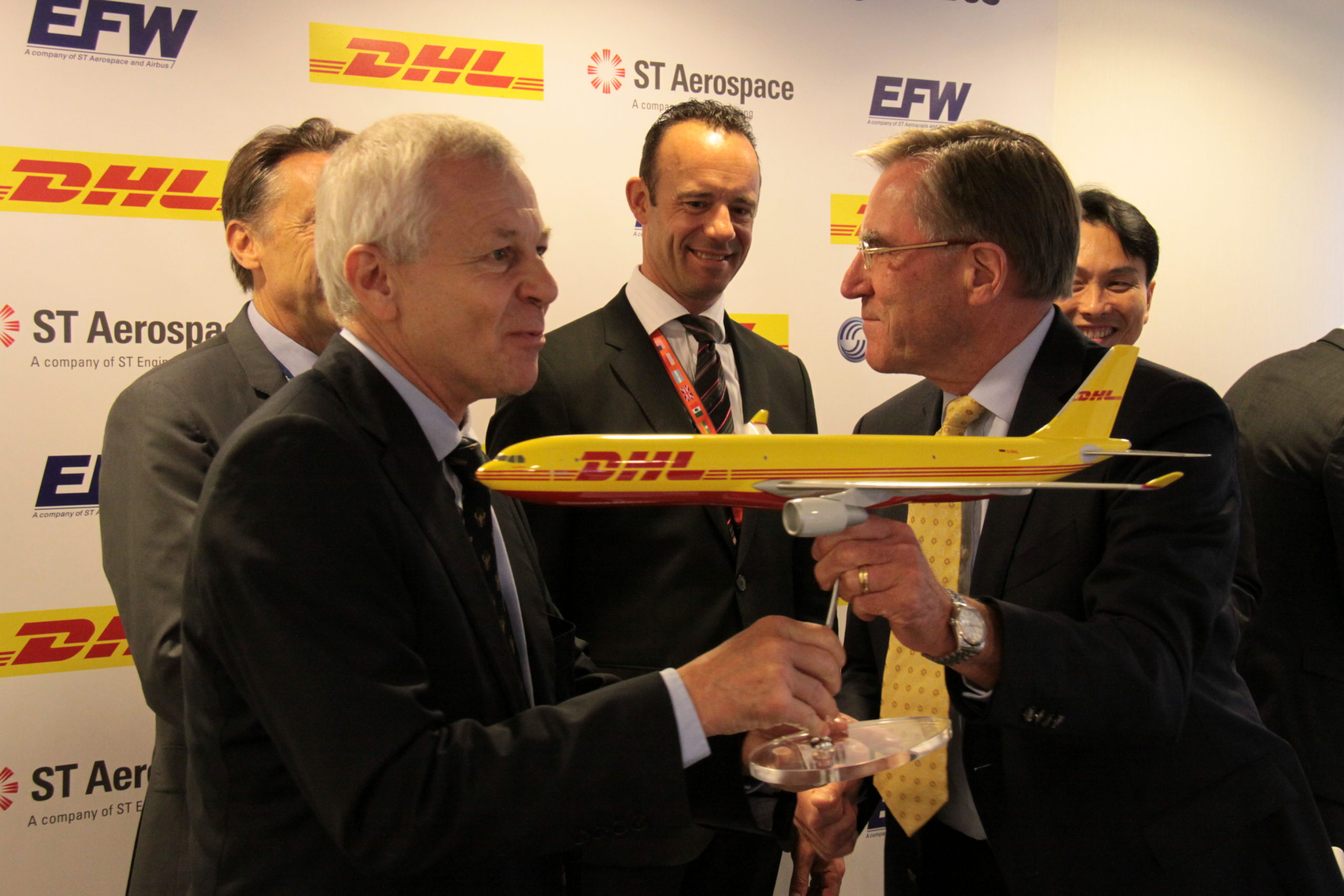 DHL is the launch customer for EFW's A330-300 P-to-F programs. Here, DHL's Geoff Kehr accepts a model of the A330-300P2F from EFW's Andreas Sperl.