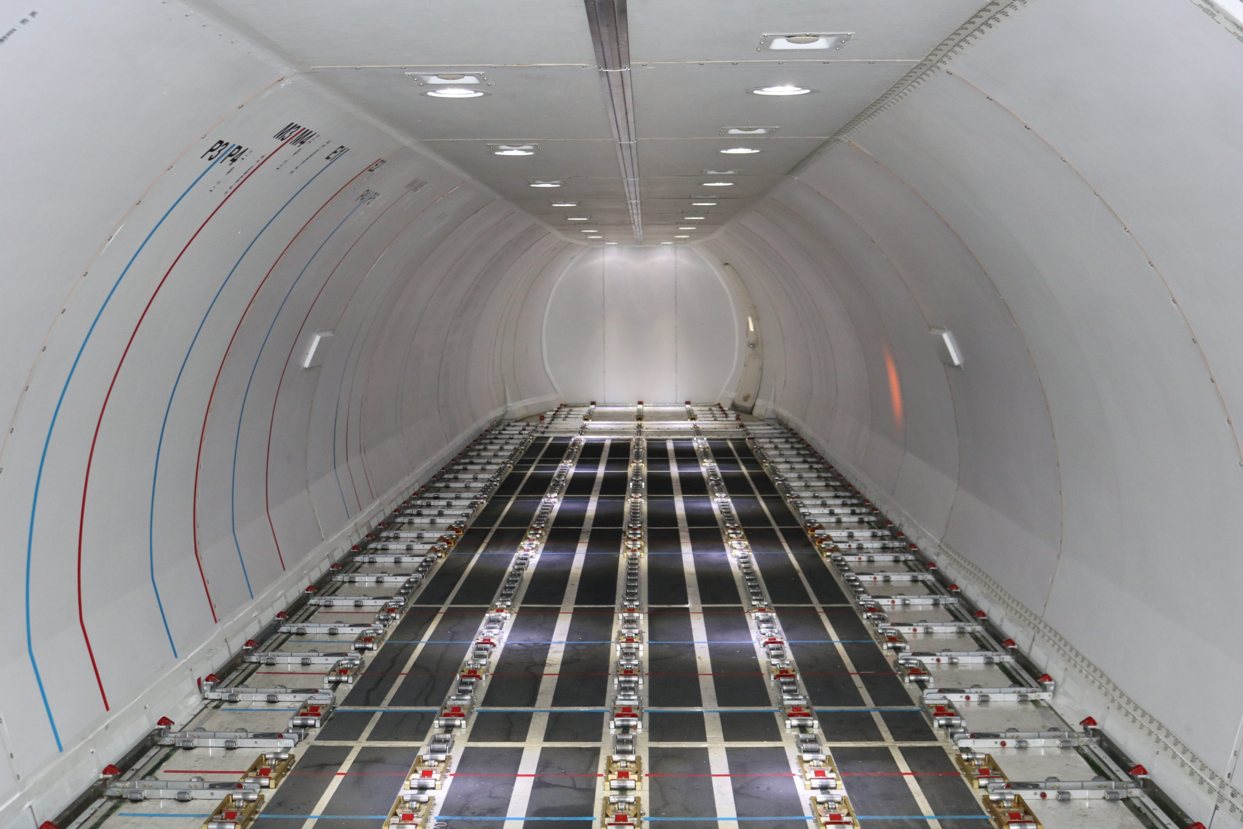 The inside of an Alaska Air 737-700BDSF equipped with an Ancra cargo loading system.
