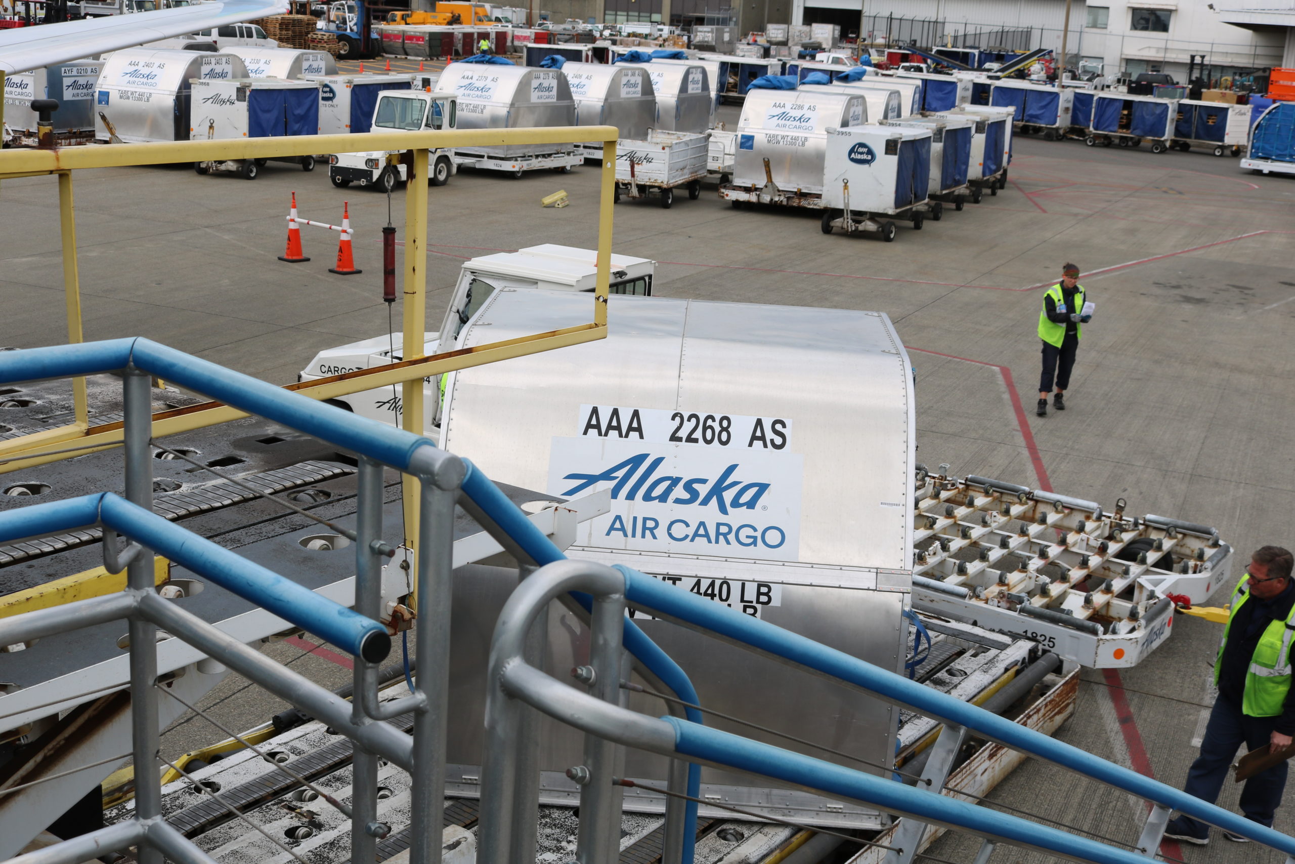 Containers being loaded on to an Alaska Air Cargo 737-700F.
