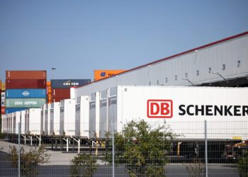 Containers are parked at a DB Schenker logistics hub in Grossbeeren, Germany