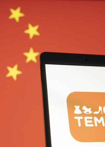 Temu logo on a cell phone against a backdrop of China's flag