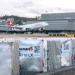 Cargo on a tarmac with a Swiss WorldCargo plane in the background