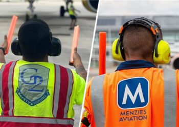Backs of ground handlers wearing vests showing G2 and Menzies logos