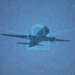 A digital lock with data radiating out semi-transparent over an airplane