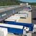 Trailers at loading bays at the Kuehne + Nagel International AG logistics center in Haiger, Germany. (Courtesy/Bloomberg)
