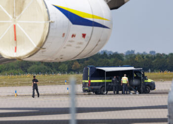 Police investigators work on the tarmac near to Ukrainian Antonov cargo plane at Leipzig/Halle Airport near Leipzig, Germany, on Aug. 5. (Courtesy/Bloomberg)