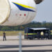 Police investigators work on the tarmac near to Ukrainian Antonov cargo plane at Leipzig/Halle Airport near Leipzig, Germany, on Aug. 5. (Courtesy/Bloomberg)